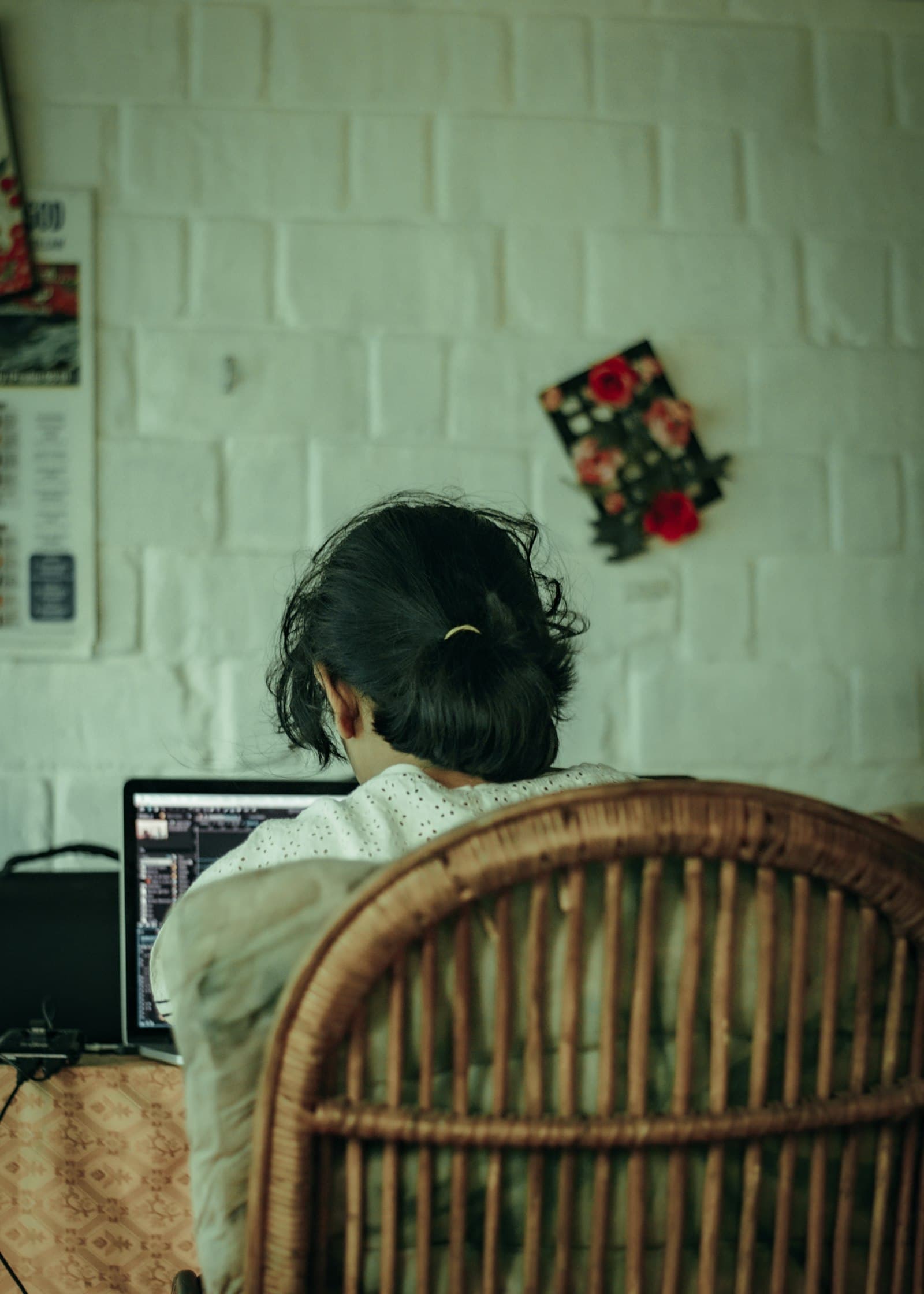 Girl attending an online maths class on the family computer