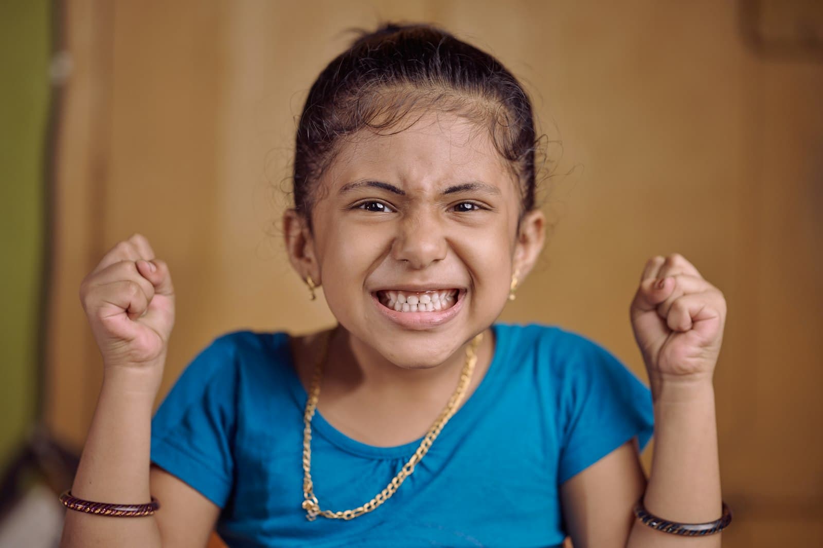 Happy Indian girl celebrating a maths answer she got right